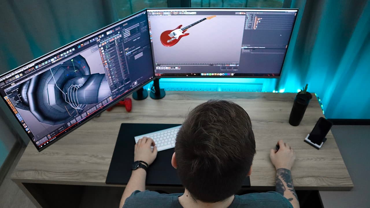 A person working at a computer on a video project