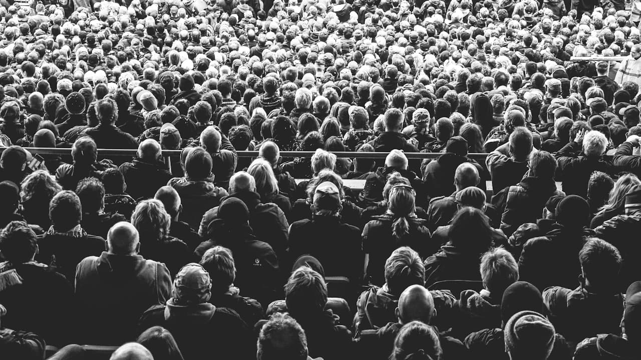An audience seated in rows facing a stage at a launch event