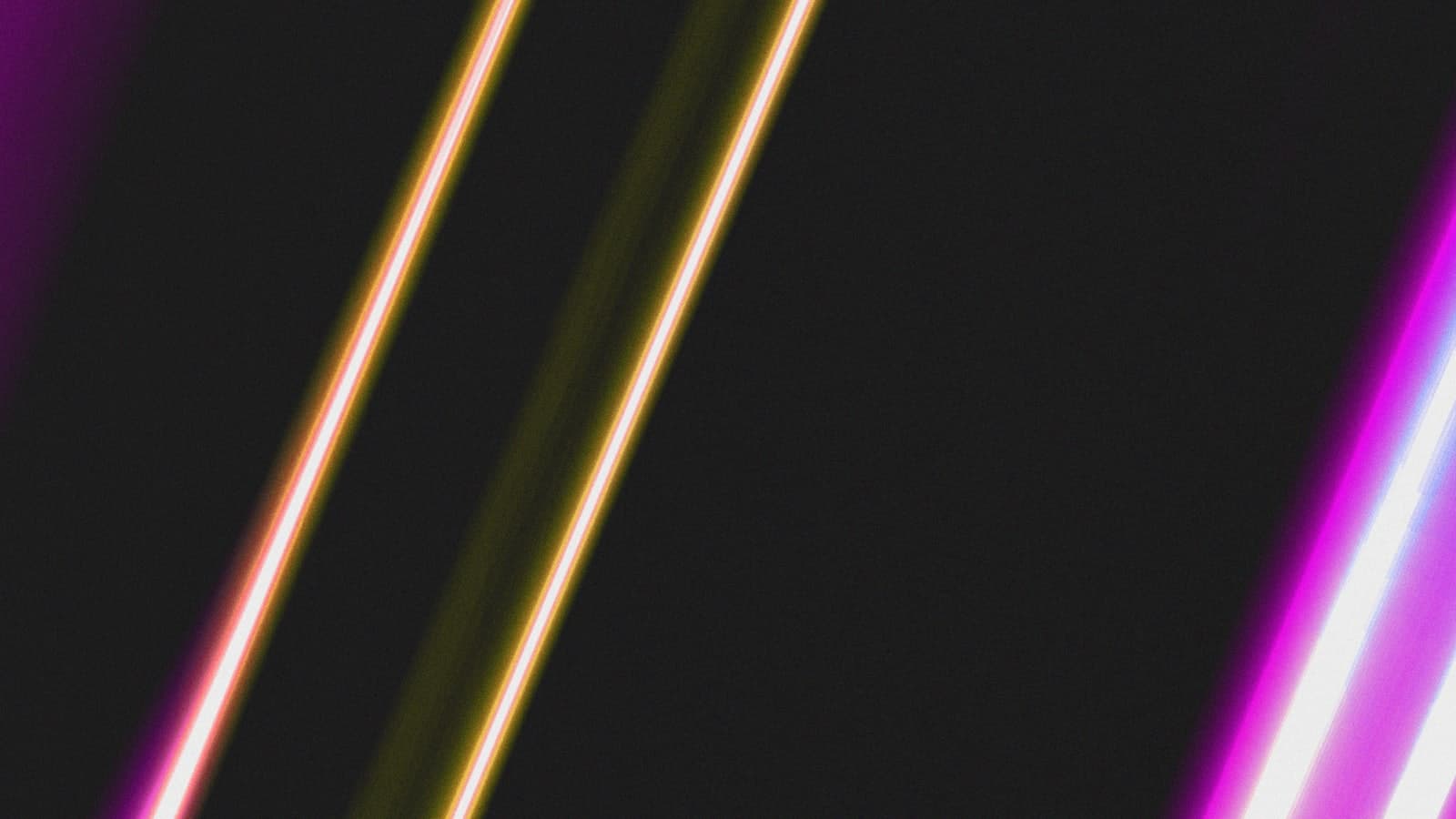 Diagonal neon light streaks against a dark background