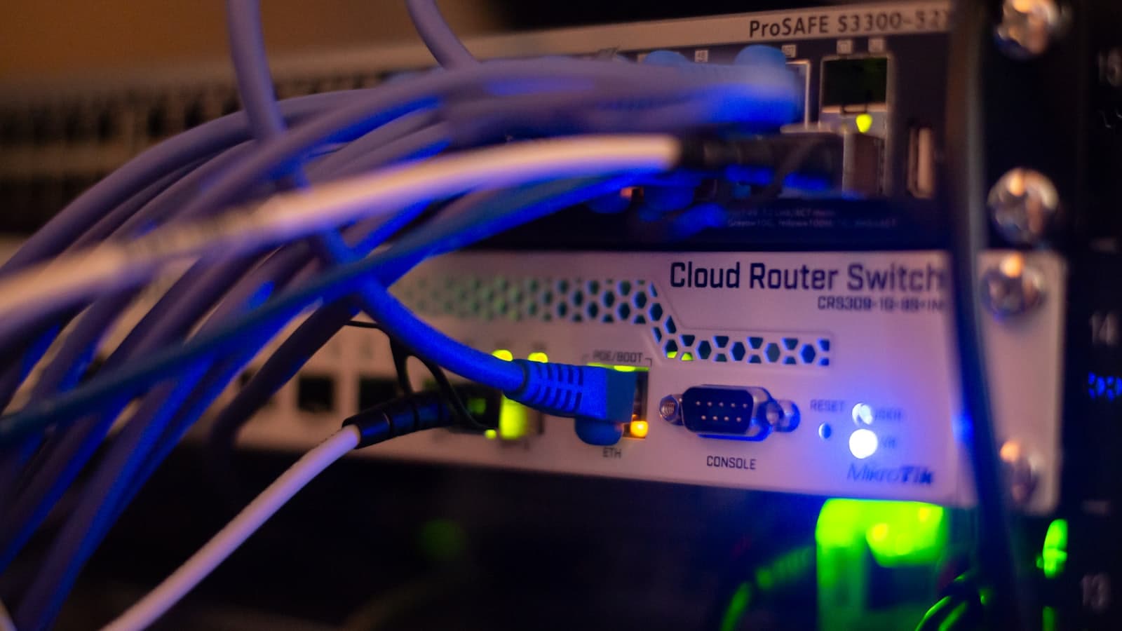 A close-up of network cabling connected in a data centre rack