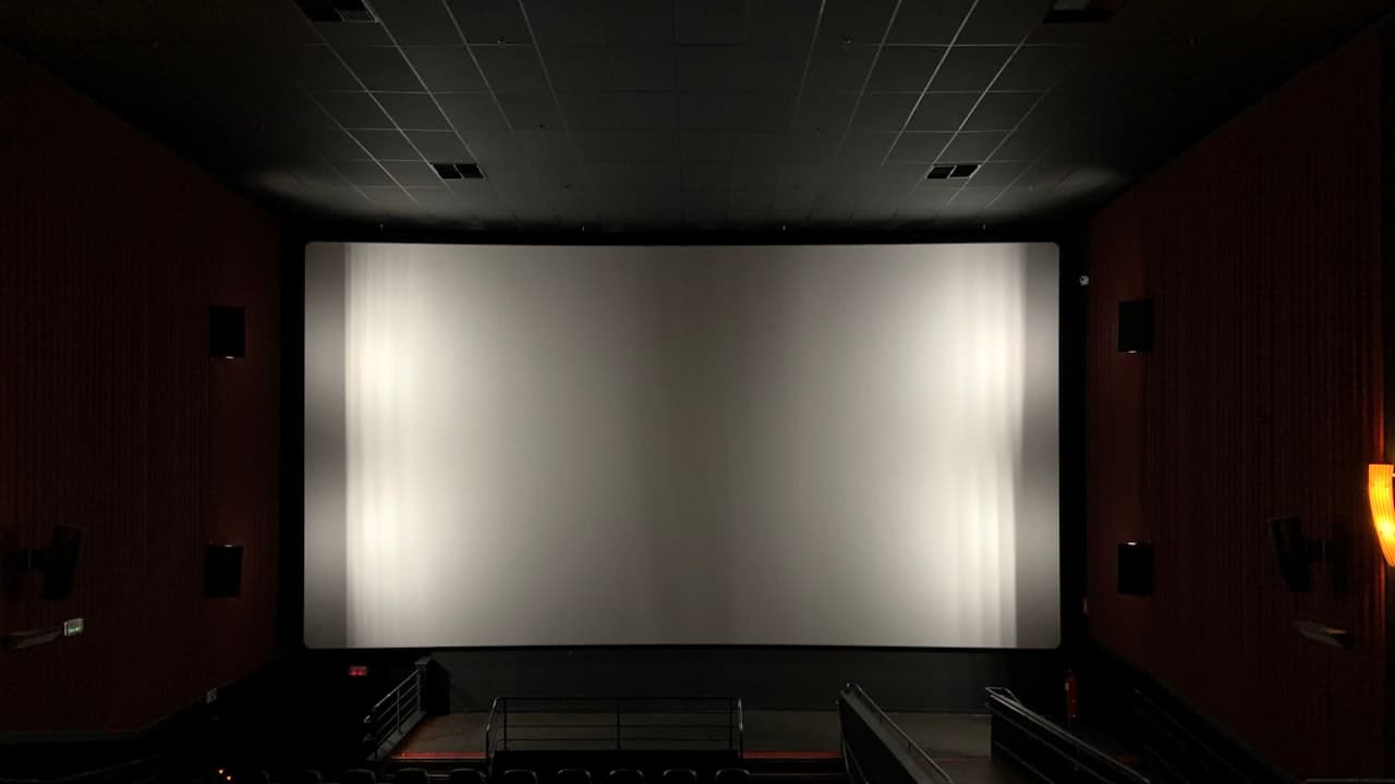 The interior of a cinema with a wide screen