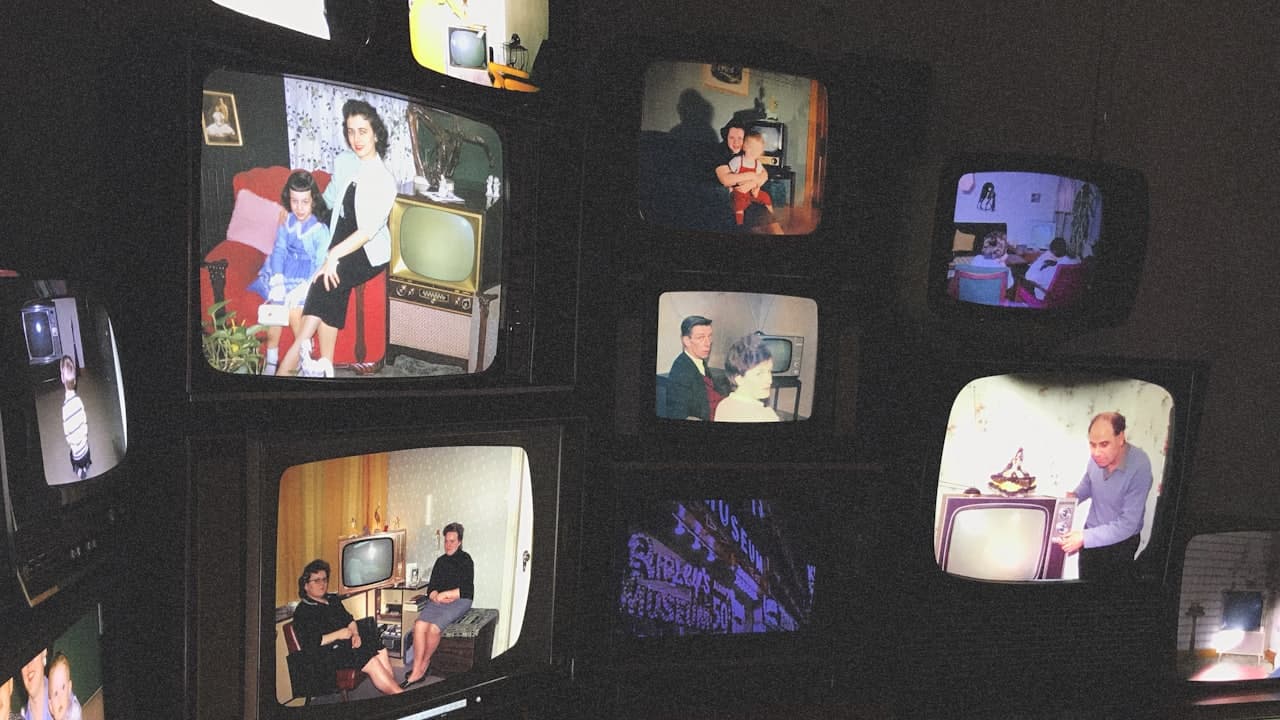 A wall of television screens showing different pictures