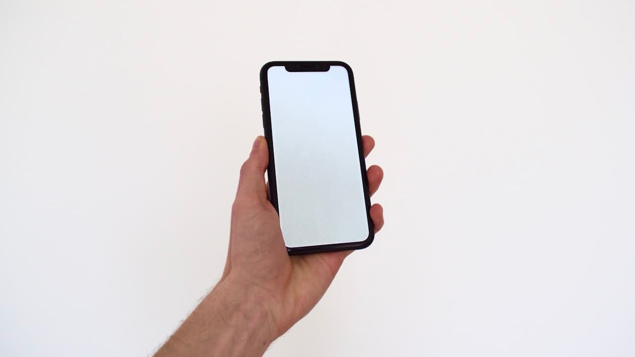 A thumb scrolling on a phone screen