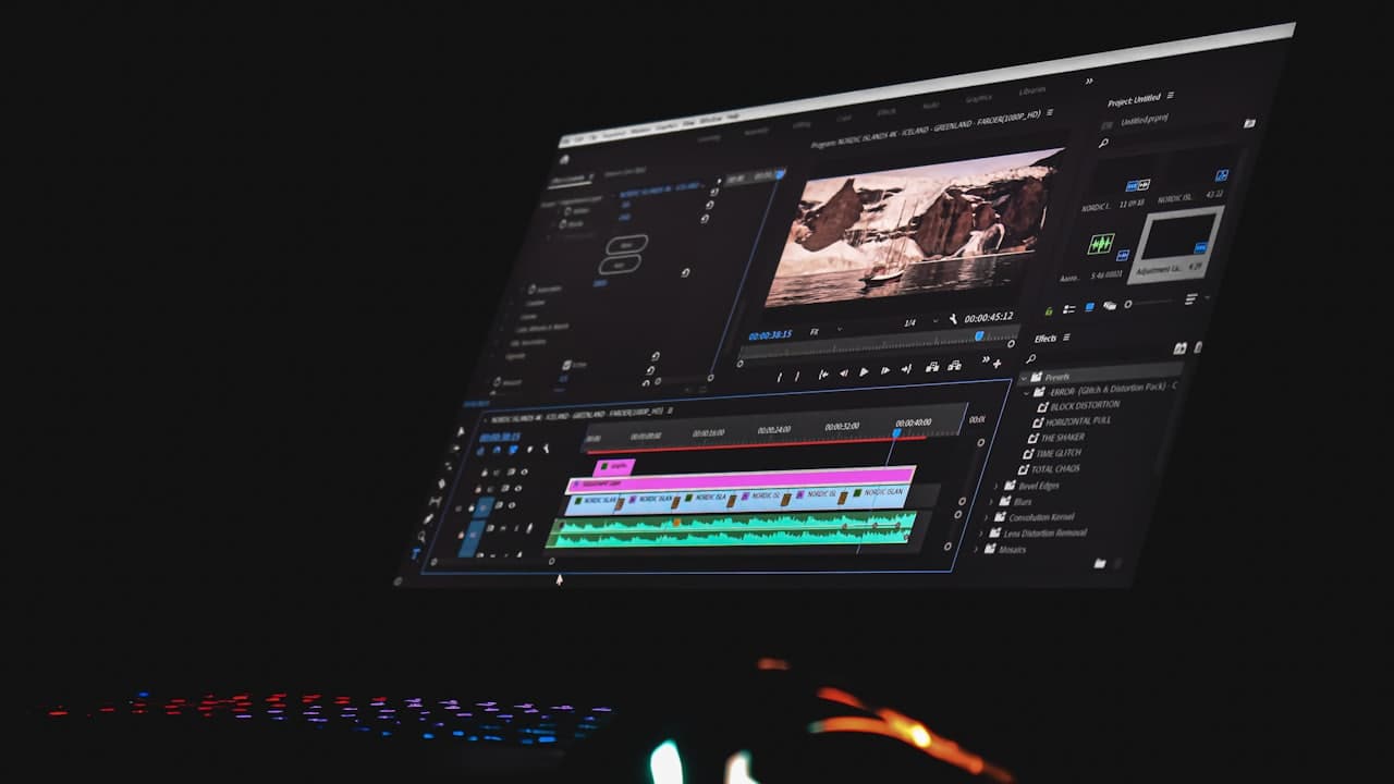 A monitor showing video editing software with a timeline and preview window